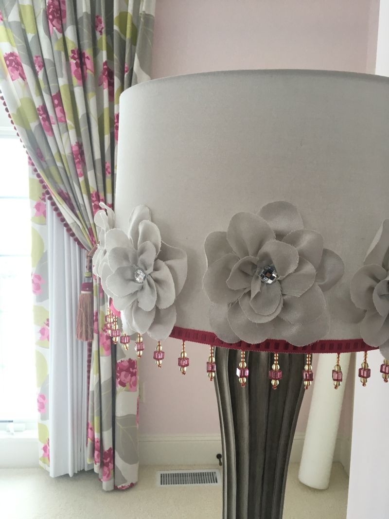 Beaded fringe on lamp. Draperies and blackout panel.