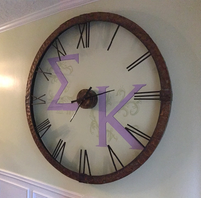 Hand painted greek letters inside the 5' clock.