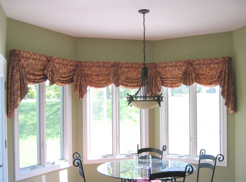 Bay window valance with flaired bells and cording.
