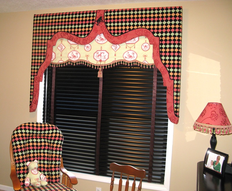 Lambrequin and fabric shade valance combination.