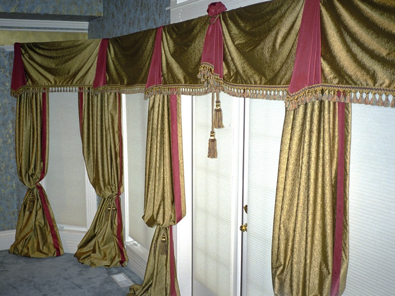 Old-world inspired decadent bedroom draperies and swags.