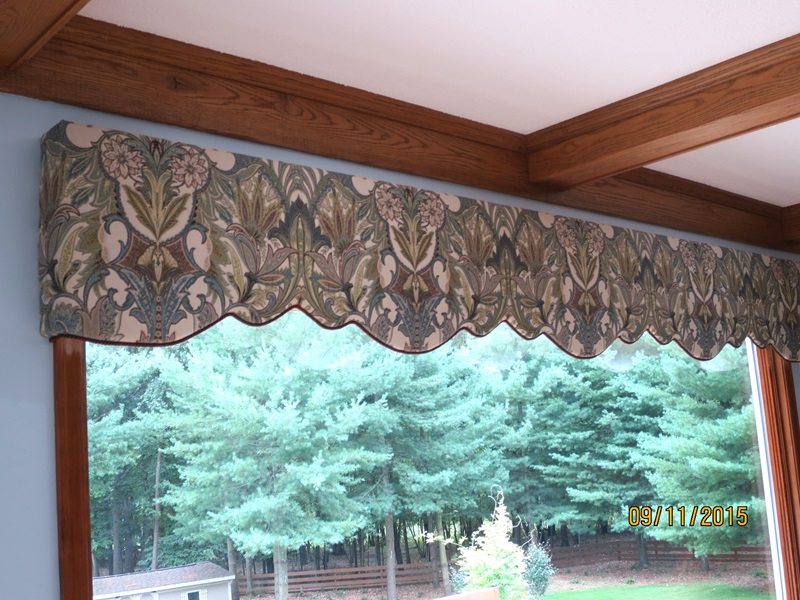 Gorgeous large cornice with curves following fabric design.