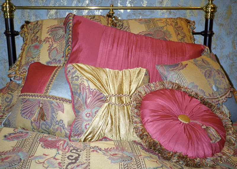 Decorative pillows, duvet, bedskirt.