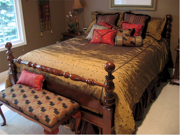 Shades of chocolates and iridescent copper. Bedding and benc
